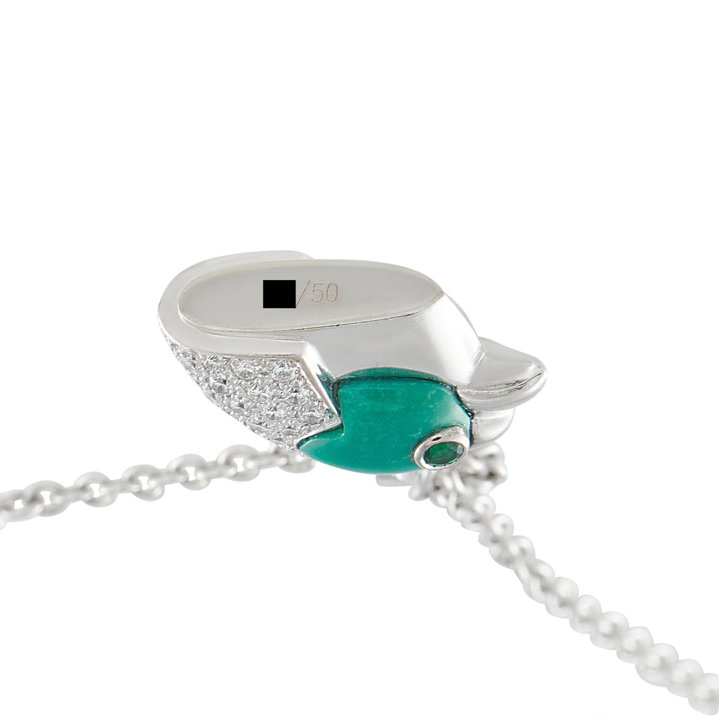 Cartier vintage eagle head pendant in 18K white gold with diamonds and green stone
