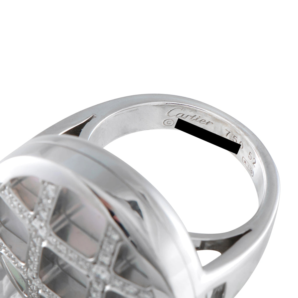 Cartier white gold diamond ring close-up showing engraved inner band