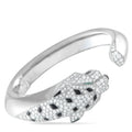 White gold cuff bracelet with diamond panther head, onyx spots, and emerald accents