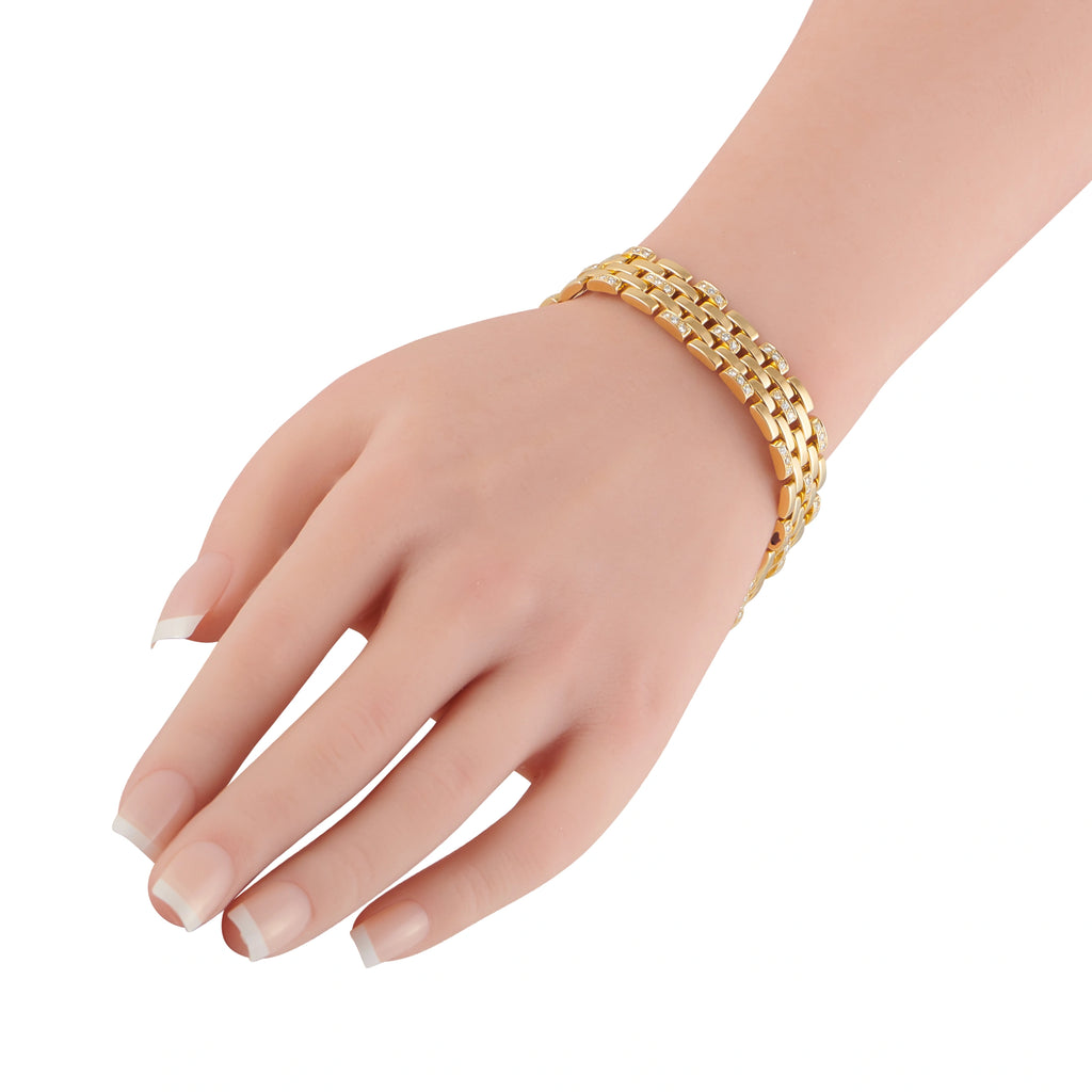 Cartier 18K yellow gold diamond bracelet on wrist with polished chain links
