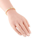 Cartier Love yellow gold diamond bracelet worn on the wrist
