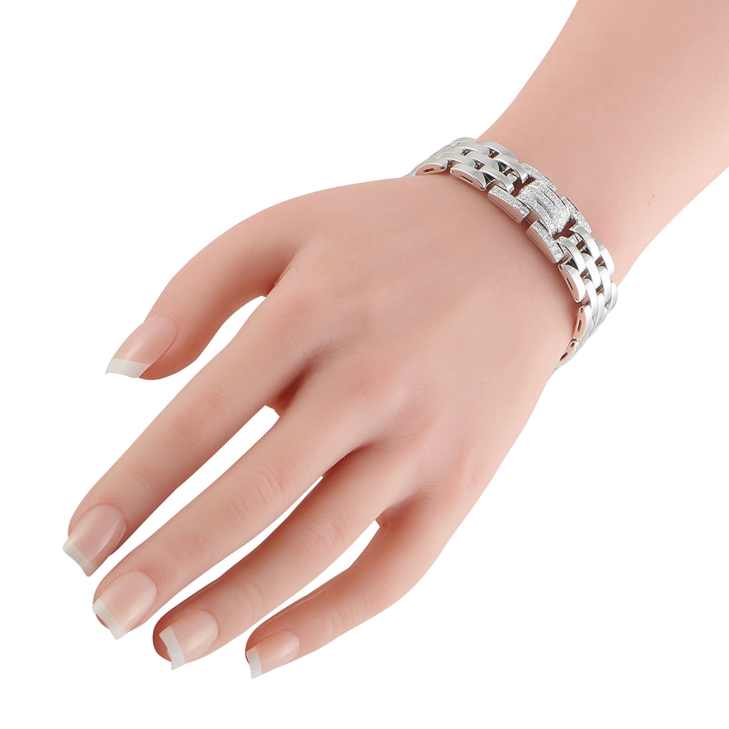 Cartier white gold diamond bracelet on wrist with linked metal and sparkle panels