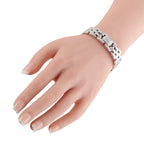 Cartier white gold diamond bracelet on wrist with linked metal and sparkle panels