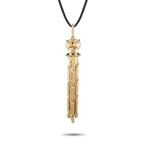 Cartier 18K yellow gold panther pendant necklace with diamonds, onyx, and tsavorite accents