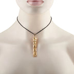 Cartier 18K yellow gold panther pendant necklace with diamonds, onyx, and tsavorite accents