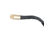 Cartier 18K yellow gold cord end cap with logo on black cord