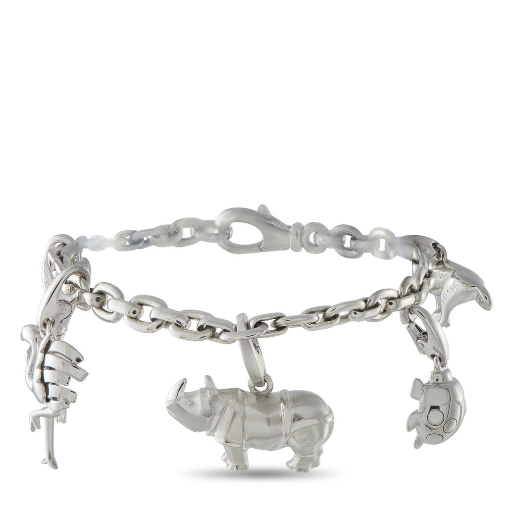 Cartier animal charm bracelet with linked chain and elephant and dog charms, silver tone