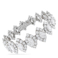 Platinum diamond bracelet with linked pavé clusters and scalloped settings