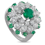 Cartier platinum diamond-and-emerald cluster ring with large green oval center stone