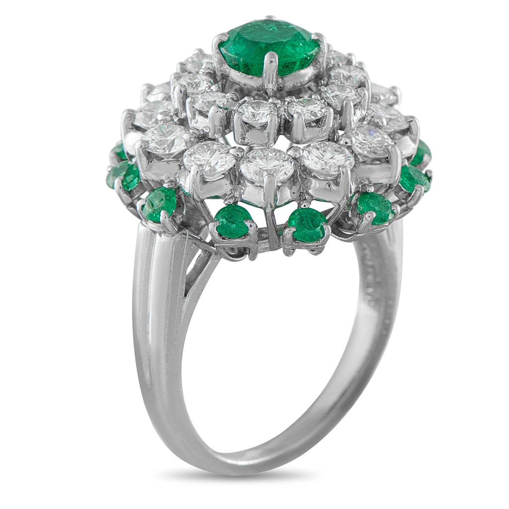 Cartier platinum ring with emerald-and-diamond clustered halo and large green center