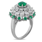 Cartier platinum ring with emerald-and-diamond clustered halo and large green center