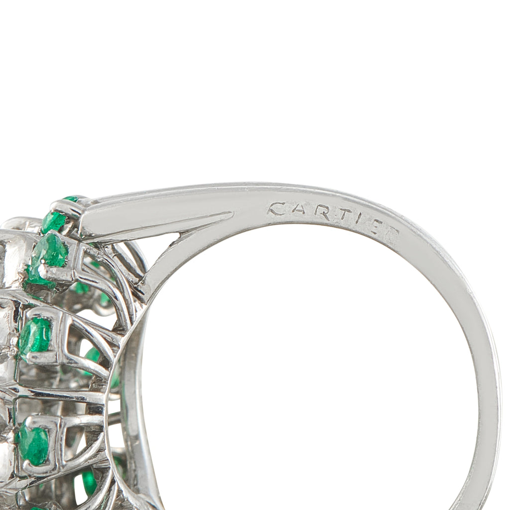 Platinum ring band engraved CARTIER, with emerald-and-diamond cluster bezel