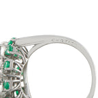 Platinum ring band engraved CARTIER, with emerald-and-diamond cluster bezel