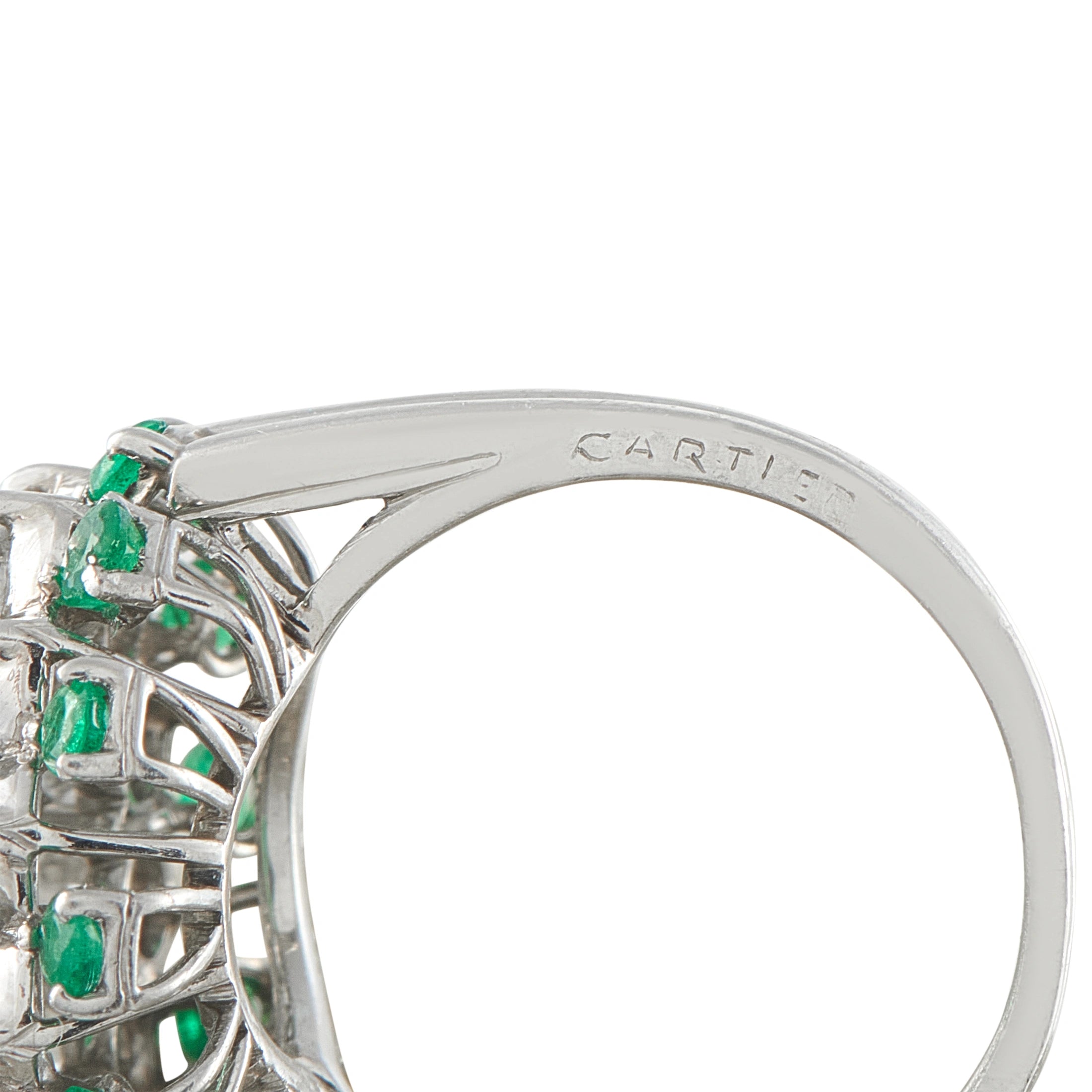 Platinum ring band engraved CARTIER, with emerald-and-diamond cluster bezel