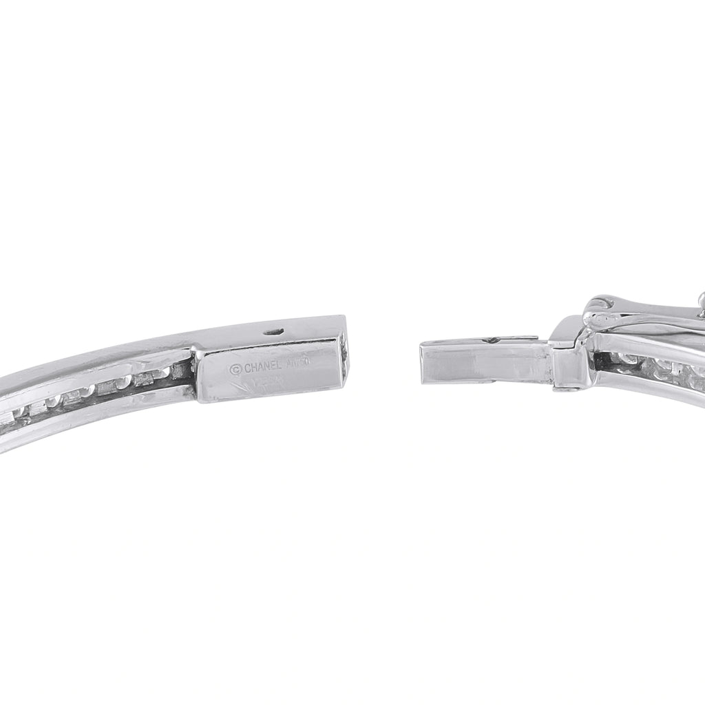 White gold diamond bracelet clasp close-up with CHANEL engraving and hinge mechanism