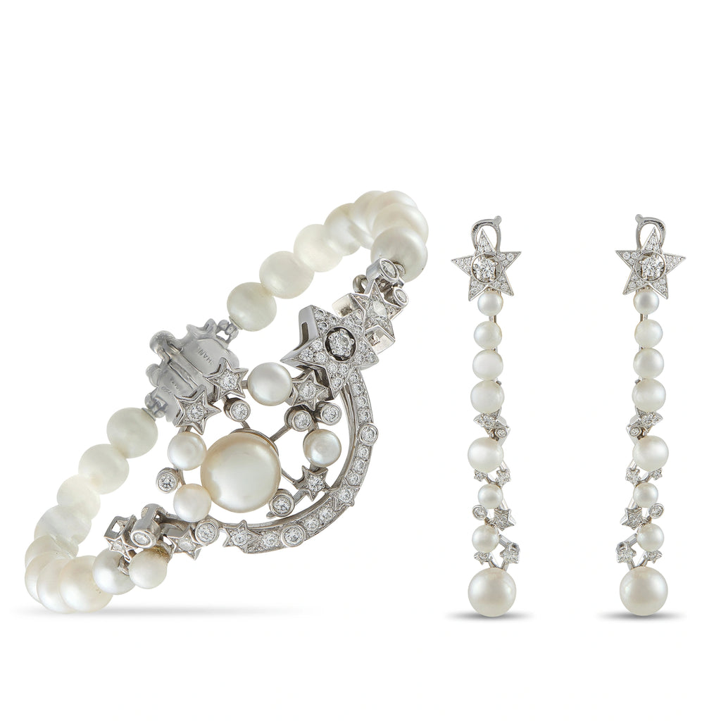 White gold hoop earrings with pearl drops and star-shaped diamond accents