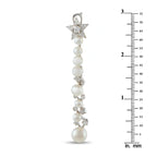 Long pearl drop earrings with star diamond motifs; length shown with ruler