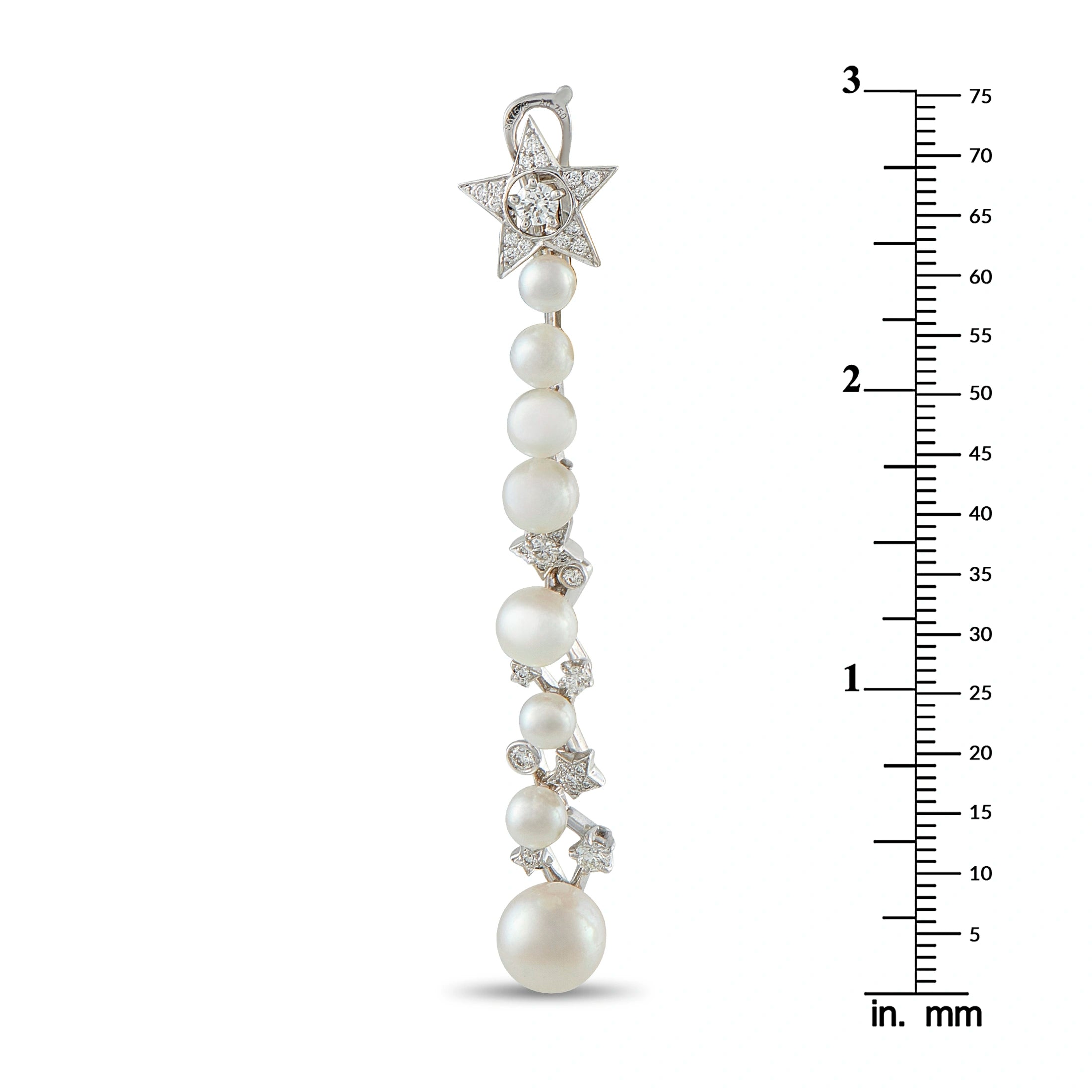 Long pearl drop earrings with star diamond motifs; length shown with ruler