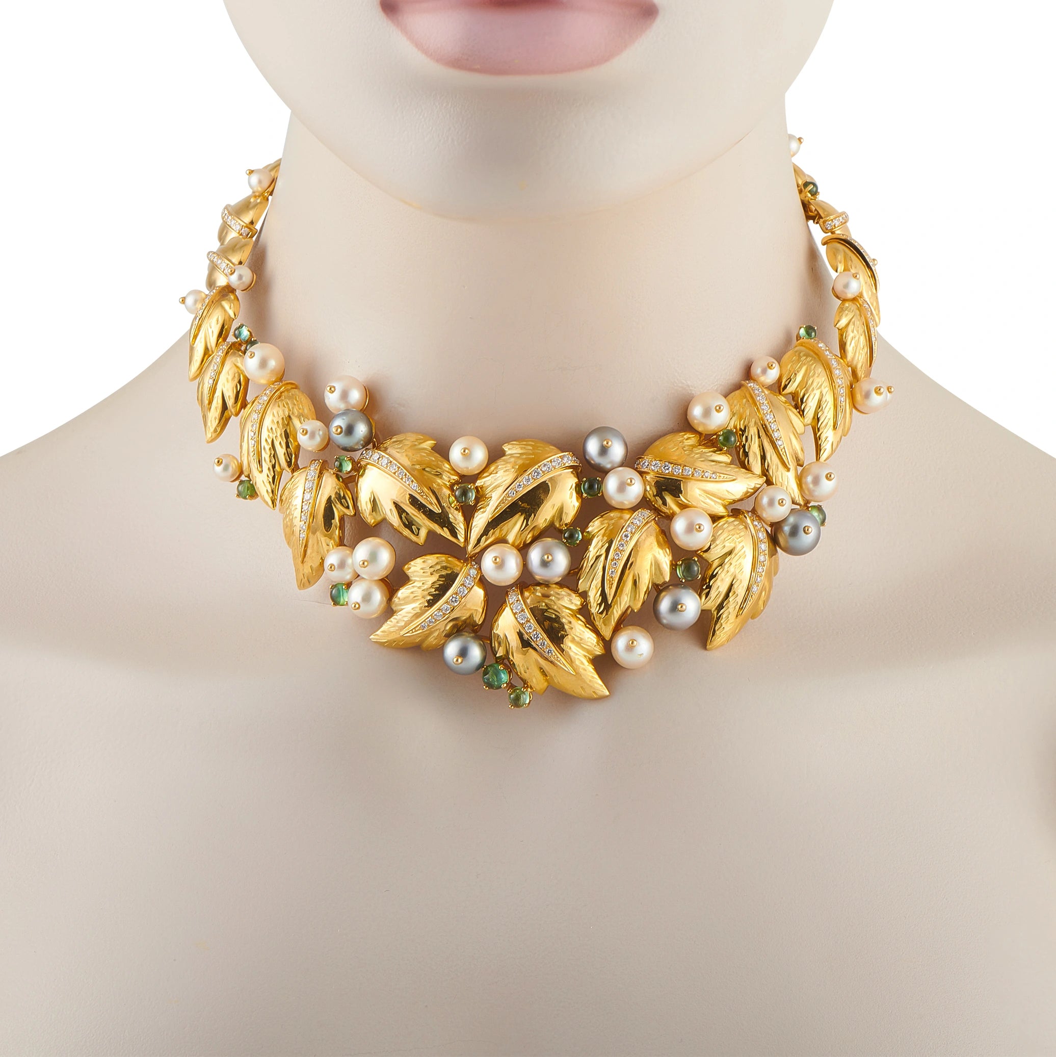 Foliage bib necklace on mannequin, 18k yellow gold with pearls, diamonds, and teal stones