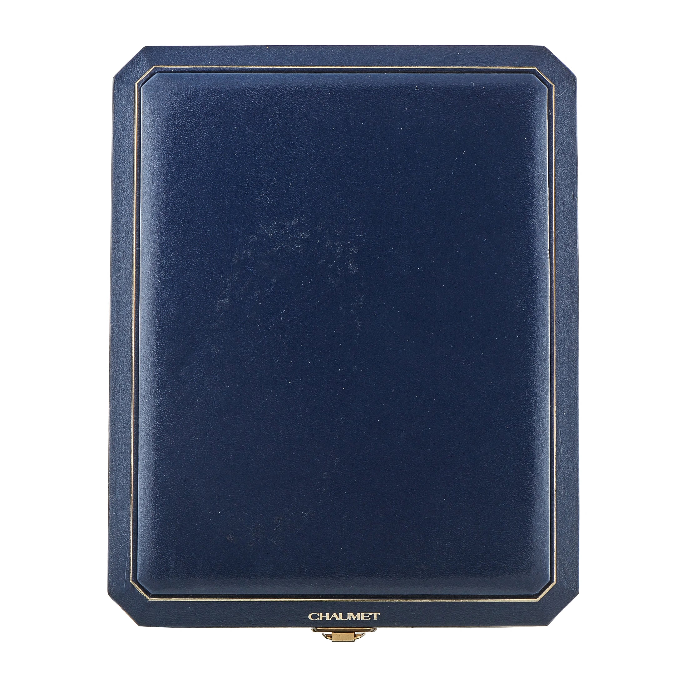 Chaumet navy jewelry box with gold trim and brand label