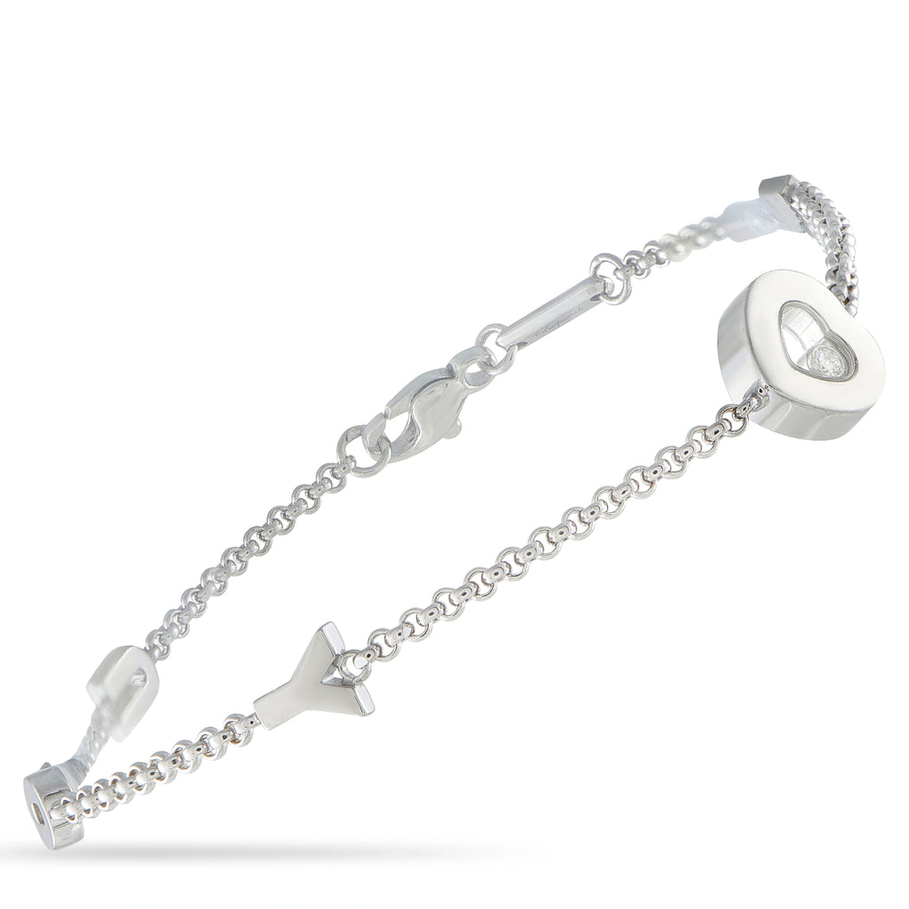 18K white gold charm bracelet with round diamond details and heart pendant