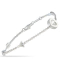18K white gold charm bracelet with round diamond details and heart pendant