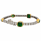 White gold peridot diamond bracelet featuring multiple green emerald-cut stones and pave diamonds