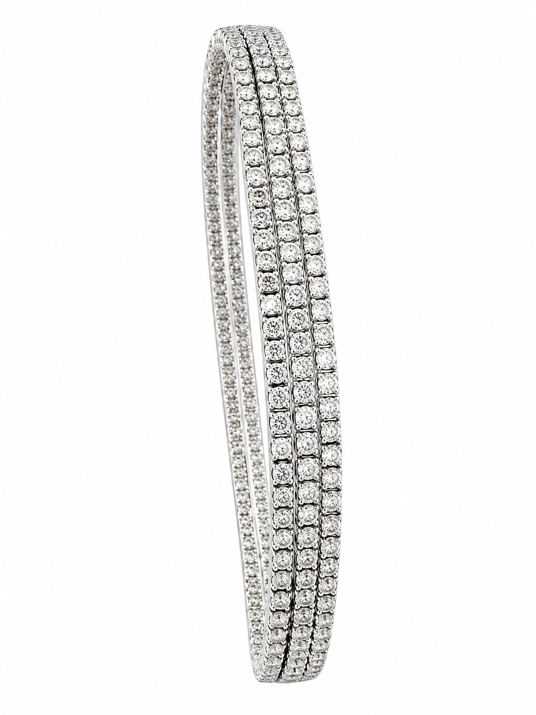 Triple-row diamond bangle bracelet with pave settings and rounded edges.