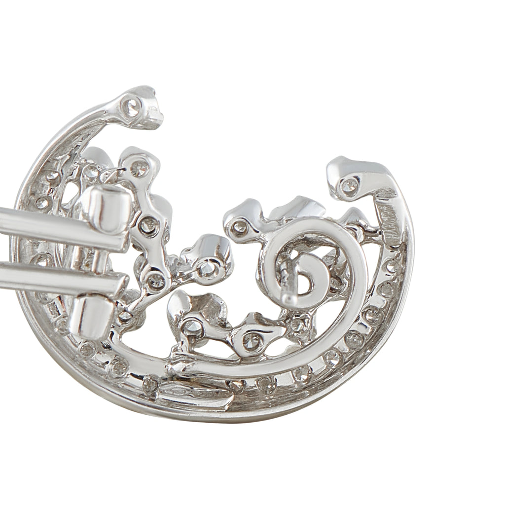 18K white gold diamond hoop earring detail: filigree prongs and clustered stones