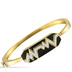David Webb18K Yellow Gold Diamond and Black Enamel Skip Bracelet – This David Webb Skip bracelet features a bold central moti
