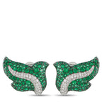 Pair of emerald green and white diamond crossover stud earrings, curved ribbon design