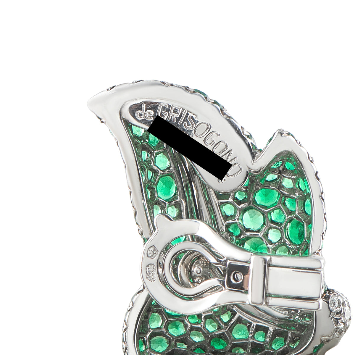 Close-up of emerald green and diamond earrings in white gold with clasp detail