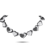 de Grisogono 18K White Gold 57.56ct Diamond Black and White Hearts Necklace – Here is a daring creation of Swiss luxury jewel