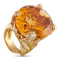 18K yellow gold ring with large oval citrine and diamond halo setting