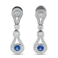 White gold diamond and sapphire drop earrings with teardrop blue stone, halo settings