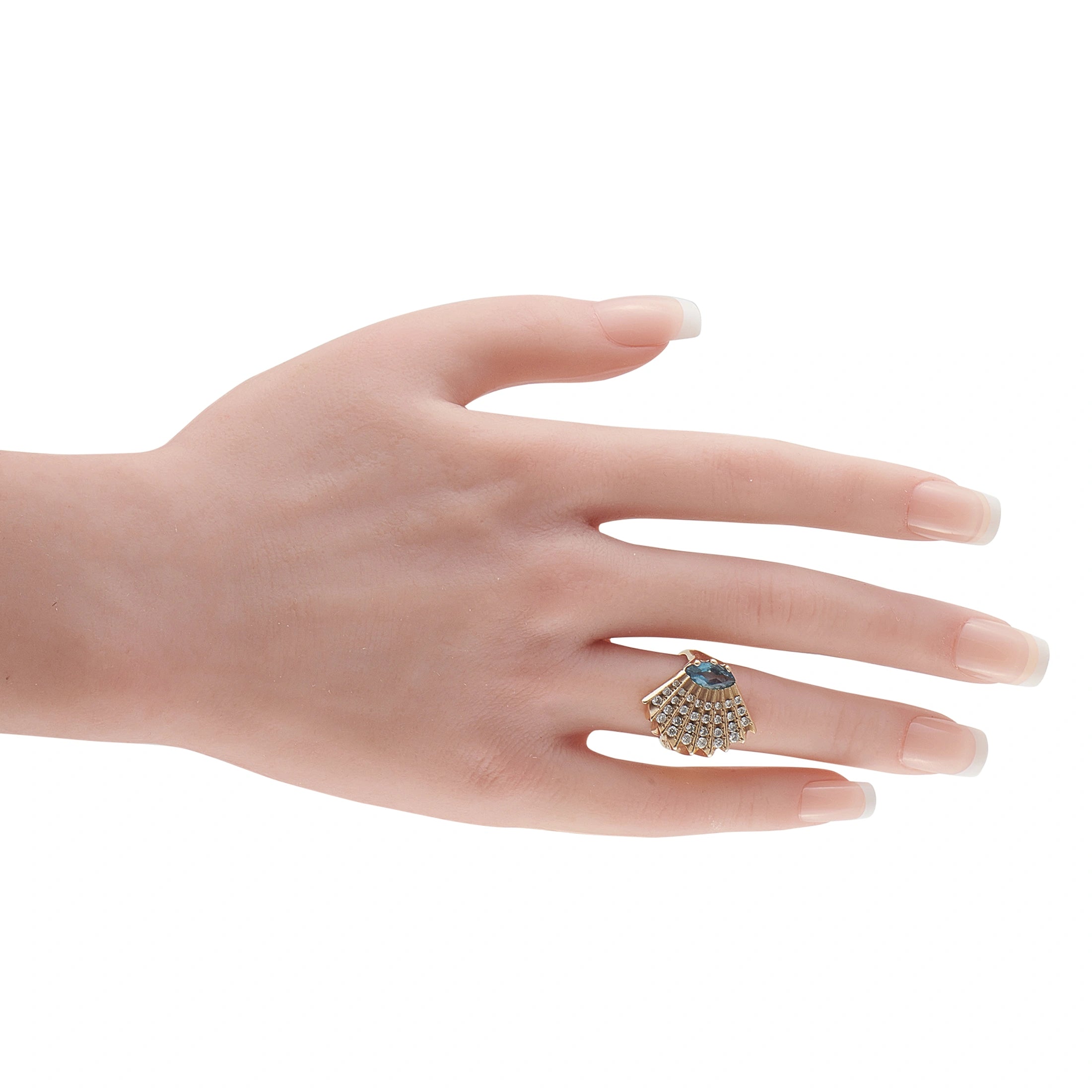 Topaz and diamond 14K yellow gold cocktail ring worn on hand