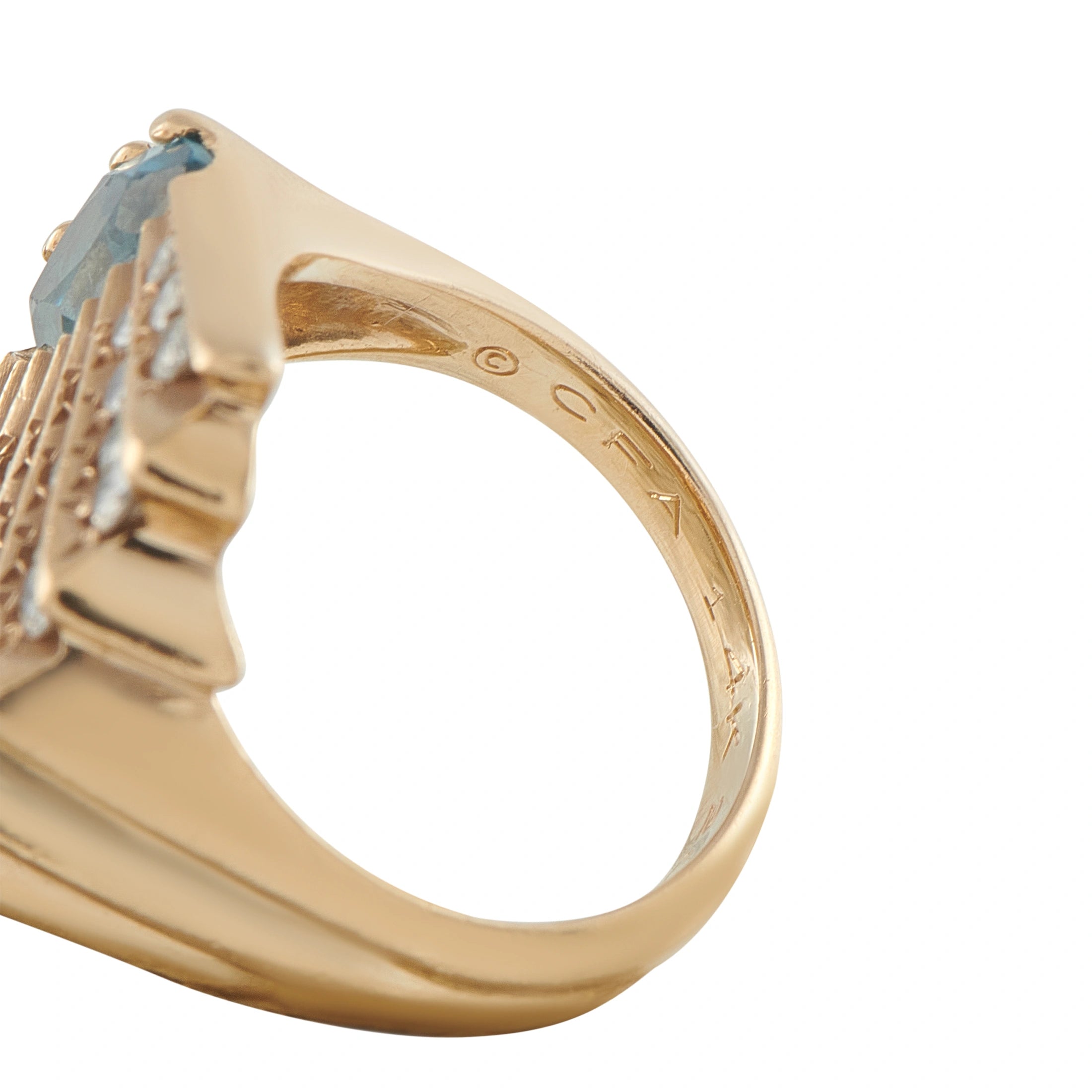 14K yellow gold topaz cocktail ring close-up with blue gemstone and diamond details