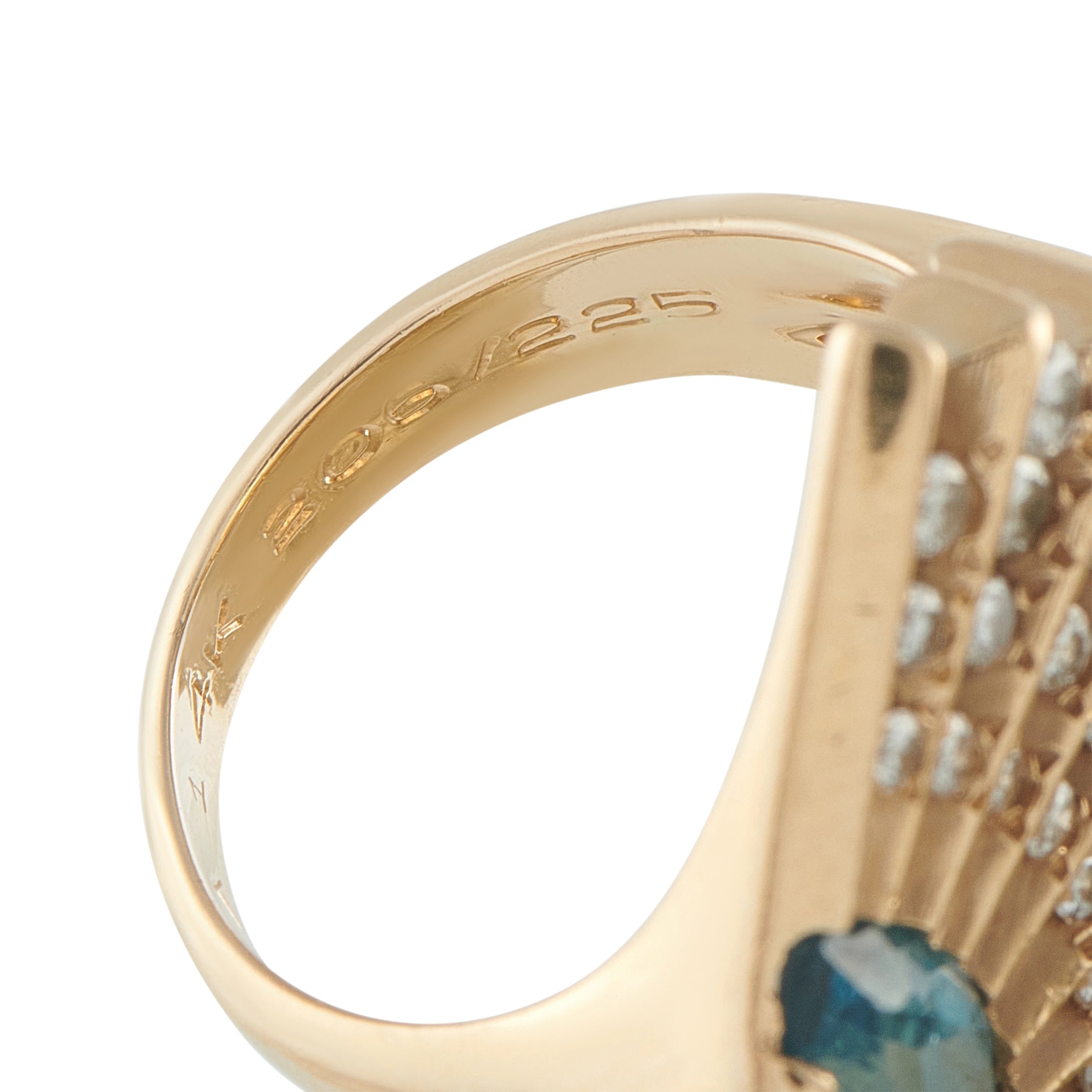 14K yellow gold ring band with engraved markings and blue topaz setting
