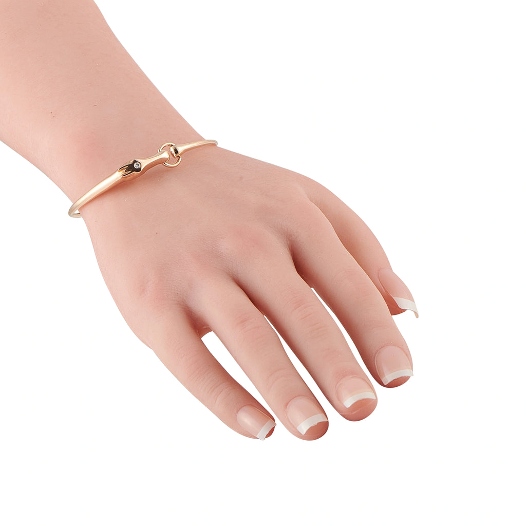 Rose gold bracelet with diamond, shown on wrist