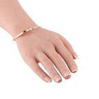 Rose gold bracelet with diamond, shown on wrist