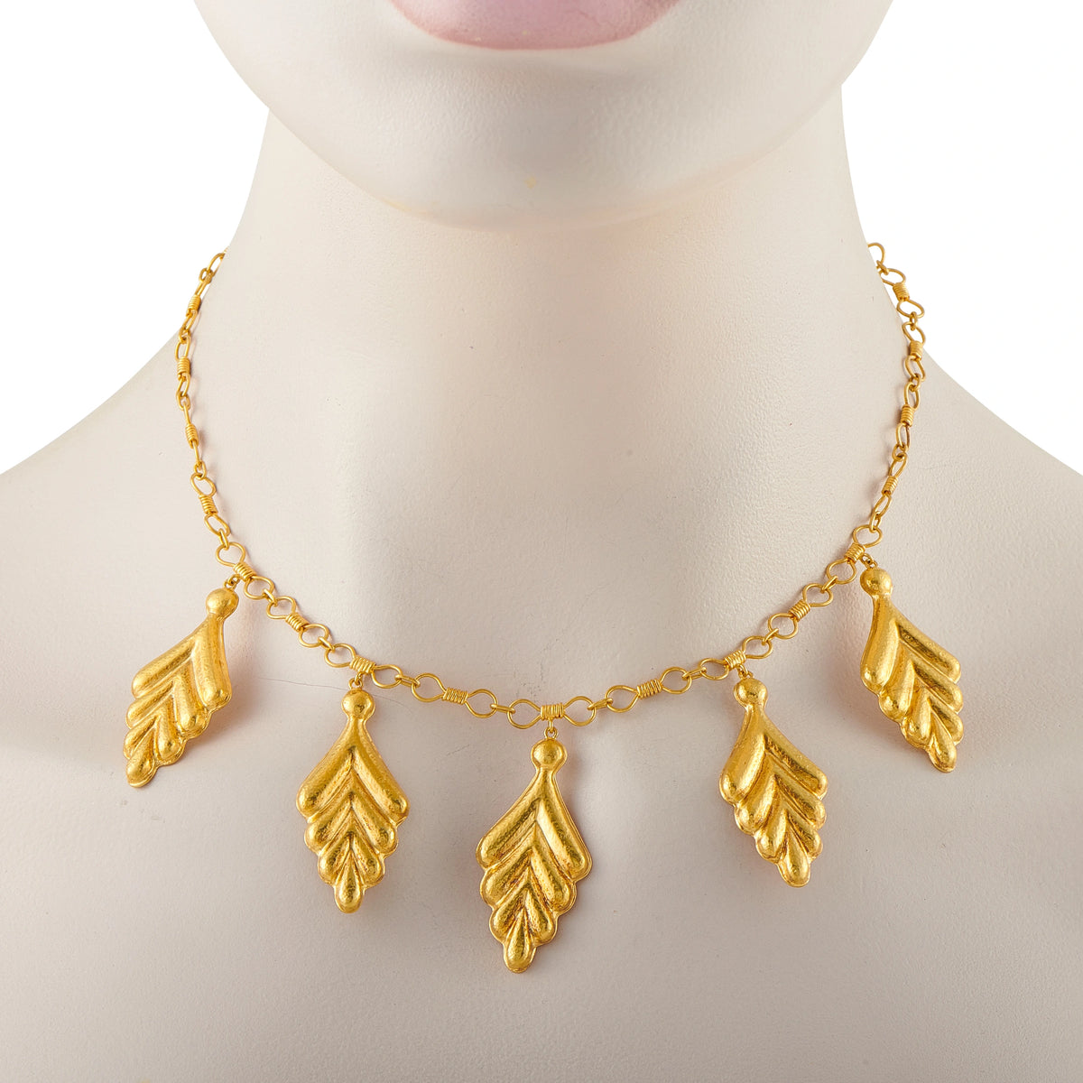 Gold leaf charm necklace with five teardrop leaf pendants on link chain
