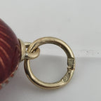 Antique yellow gold egg pendant bail loop with circular opening and maker stamp