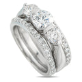 White gold 3-row diamond ring with three round center stones