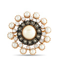 Round pearl and diamond brooch with dark center and gold-tone bezel
