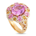 Rose gold ring with oval pink center stone, pink accents, and diamond halo