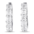 White gold hoop earrings with baguette-cut diamond accents, front view