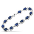 18K white gold bracelet with blue oval sapphires and diamond halos