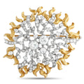 Two-tone gold diamond brooch with round and oval stones in an ornate floral spray