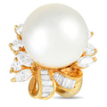 Gold ring with large white pearl center, diamond accents, and curved prong setting
