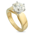 Yellow gold solitaire diamond ring with round center stone in four-prong setting